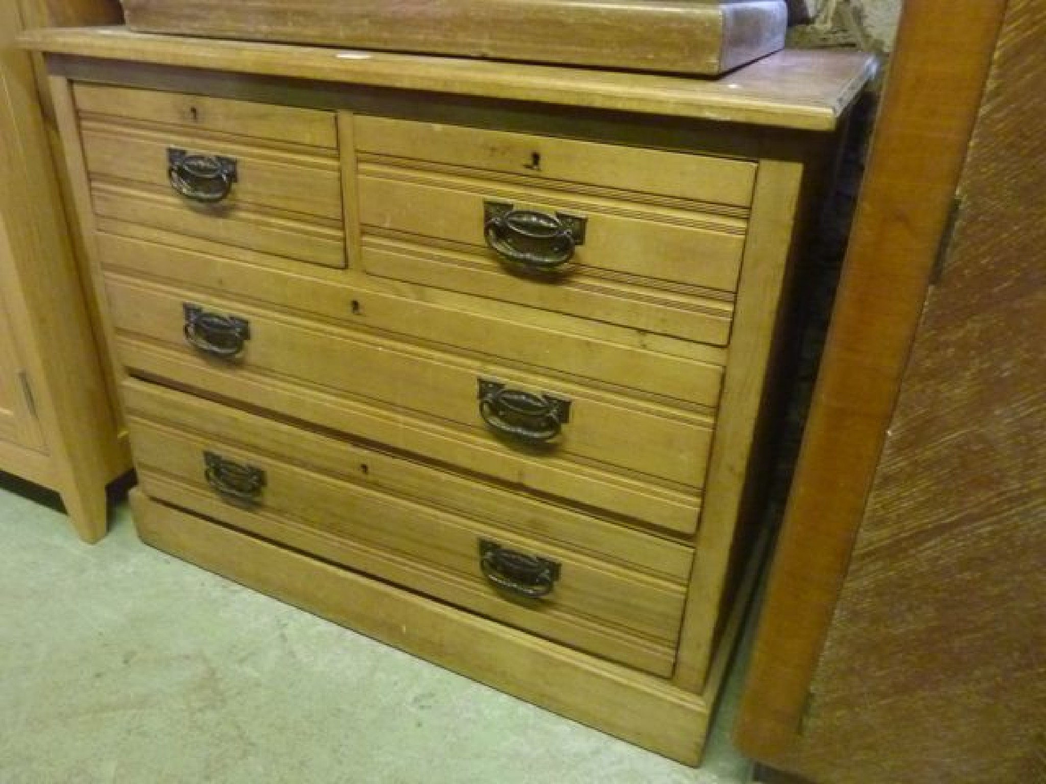 Appraisal: An Edwardian walnut bedroom chest of two long and two