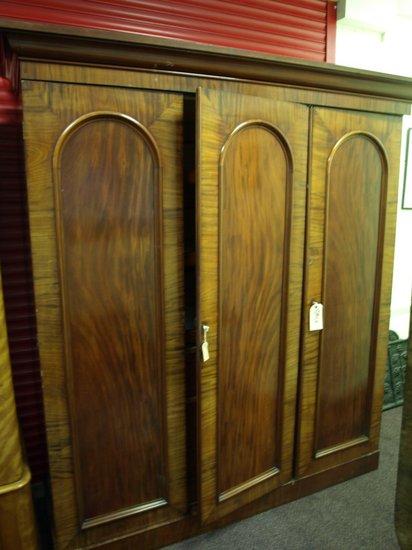 Appraisal: A Victorian mahogany wardrobe fitted for hanging with drawers and