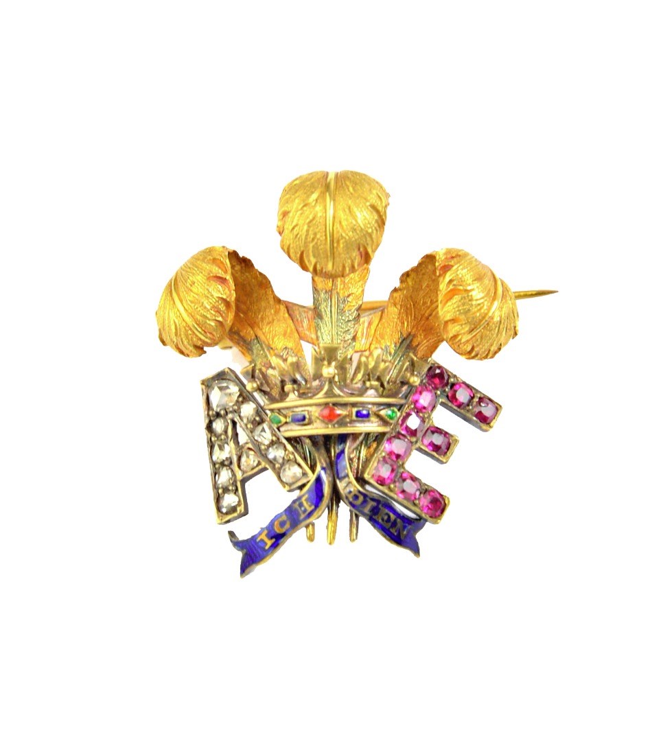 Appraisal: A gold diamond and ruby set and enamelled brooch designed