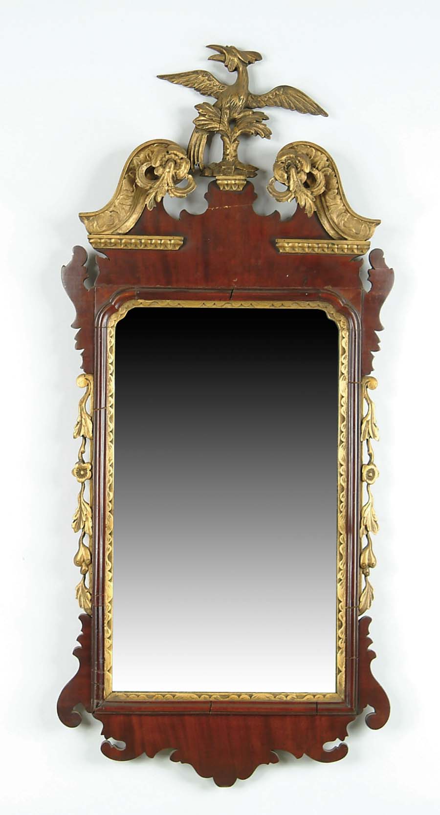 Appraisal: MAHOGANY CHIPPENDALE FANCY MIRROR WITH PHOENIX Gilt wood carved crest