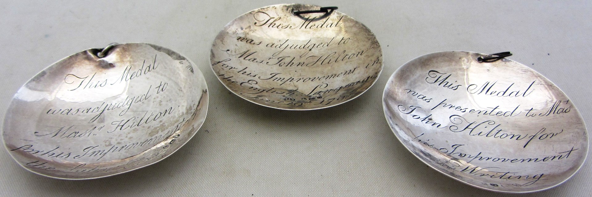 Appraisal: Three silver circular dish shaped prize medallions as awarded to