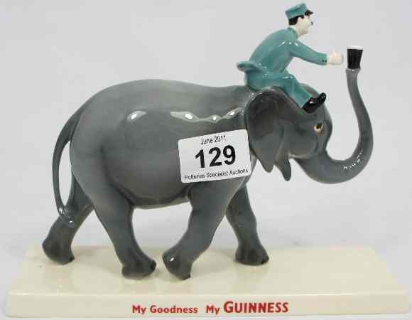 Appraisal: Coalport Advertising Figure Guinness Elephant and Keeper for Millennium Collectables