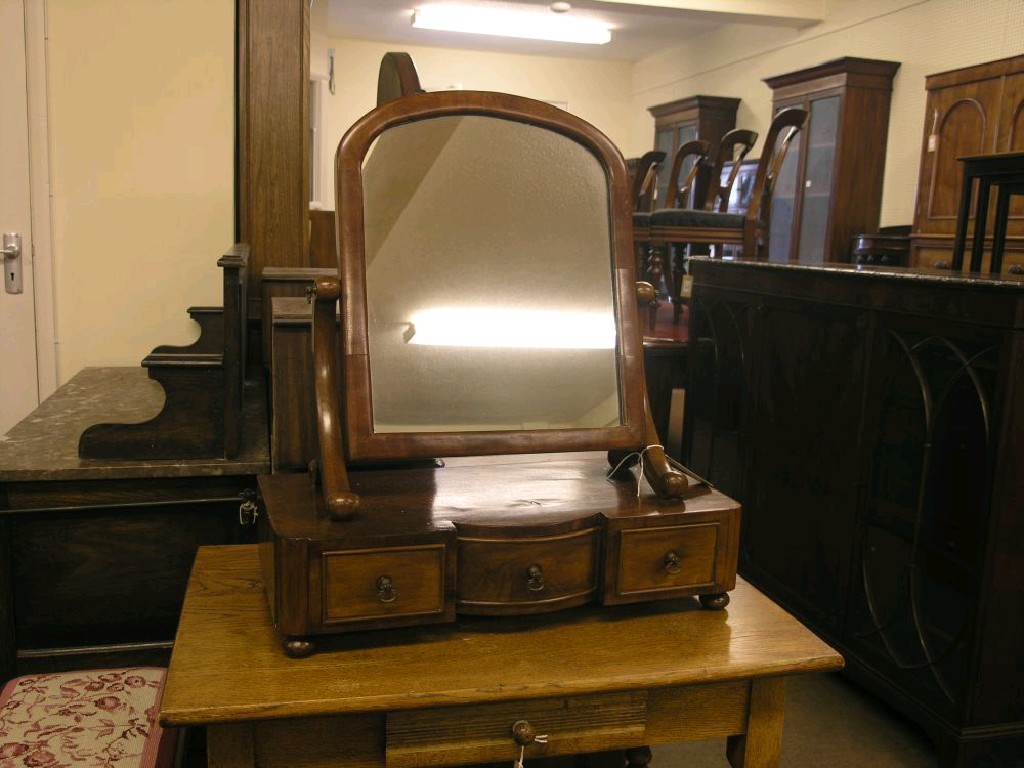 Appraisal: A mahogany toilet mirror mirror plate adjustable on feather-veneered base