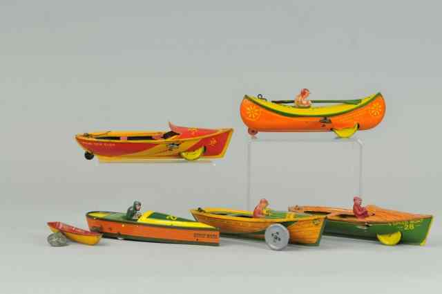 Appraisal: GROUPING OF CANOES AND BOATS Lithographed tin includes Strauss Miami