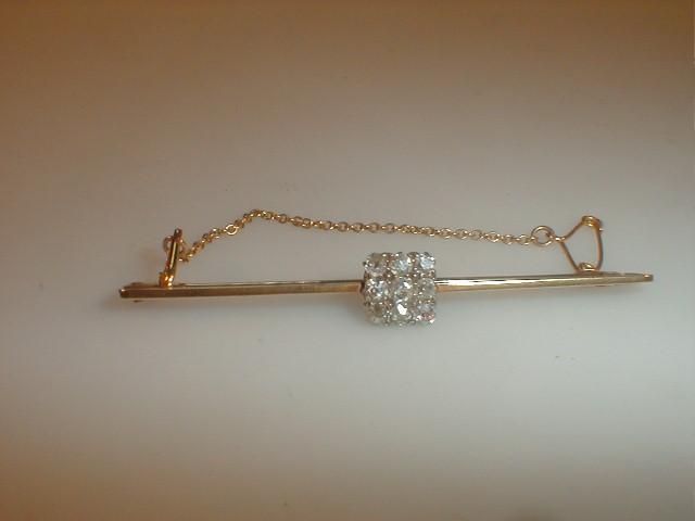 Appraisal: A bar brooch set with a small square of nine