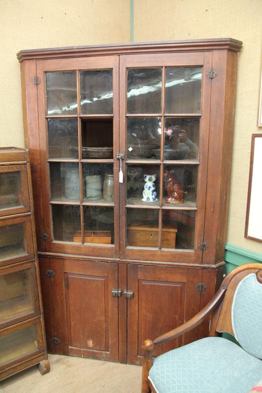 Appraisal: TWO PIECE CORNER CUPBOARD Walnut with a molded cornice two