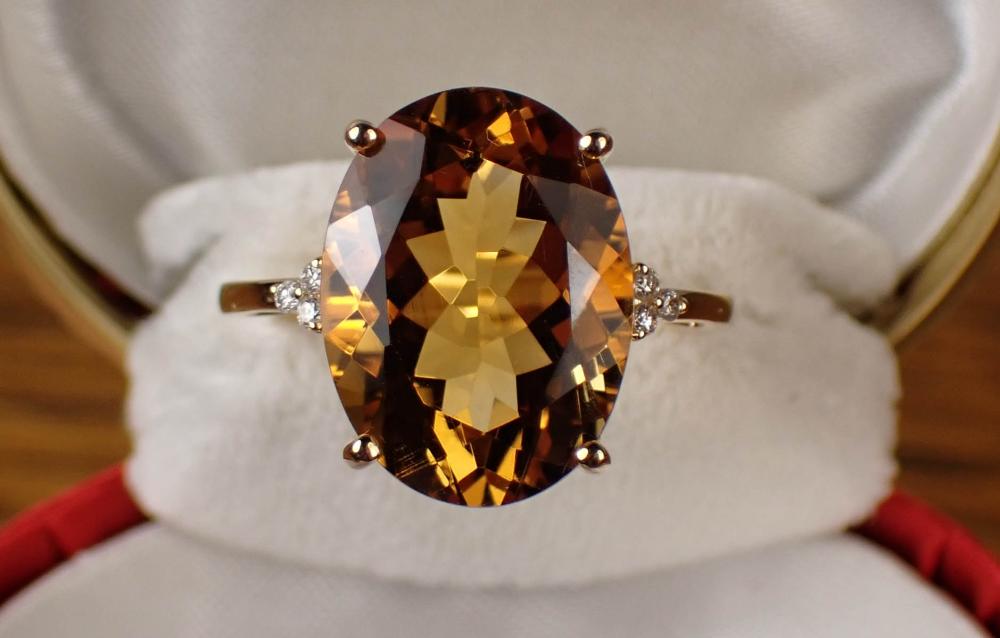 Appraisal: CITRINE DIAMOND AND FOURTEEN KARAT GOLD RING with three round-cut