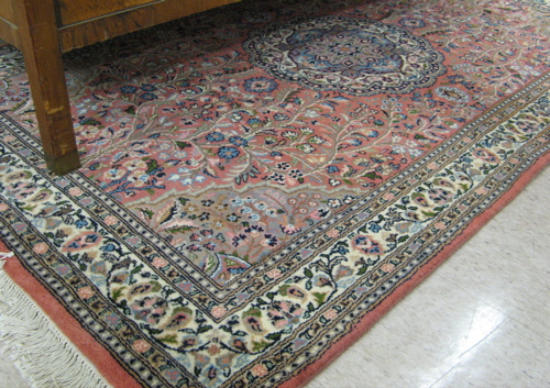 Appraisal: HAND KNOTTED ORIENTAL AREA RUG Pakistani-Persian floral and central floral