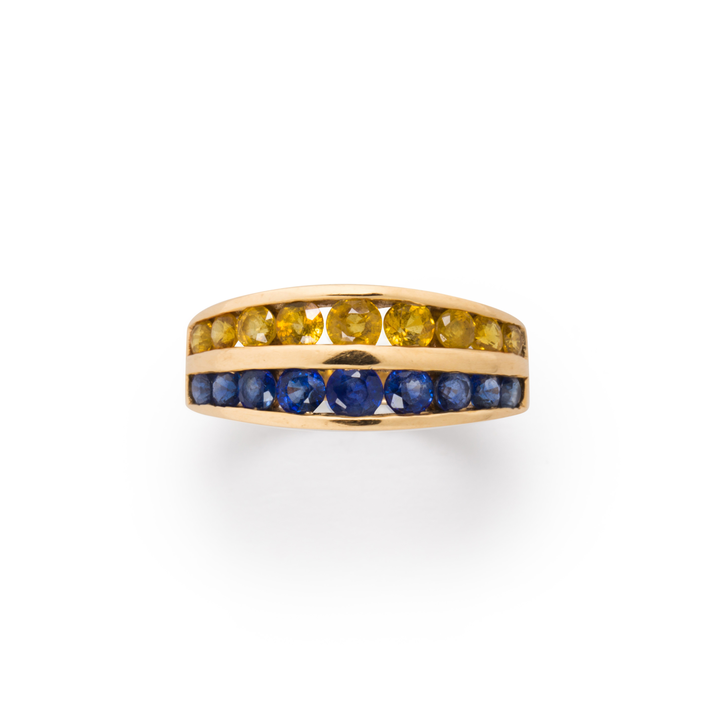 Appraisal: A YELLOW OR BLUE SAPPHIRE AND FOURTEEN KARAT GOLD RING