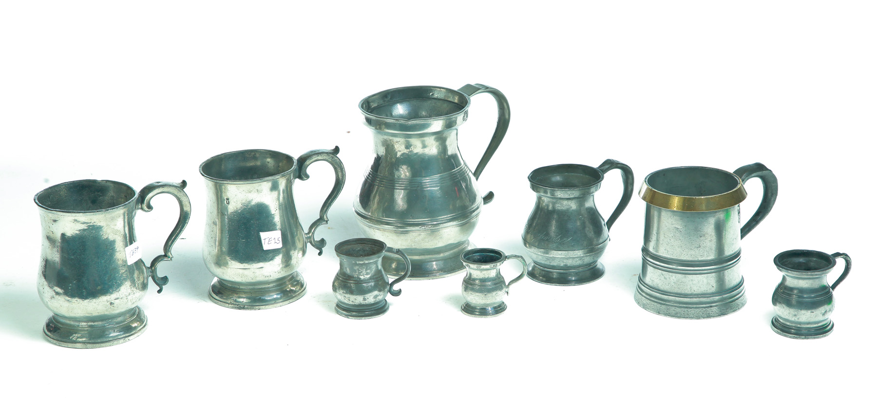 Appraisal: EIGHT ENGLISH PEWTER MEASURES Nineteenth century Five assorted bellied measures