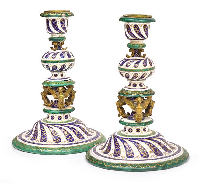 Appraisal: A PAIR OF EMPIRE STYLE ENAMEL AND ORMOLU CANDLESTICKS TH