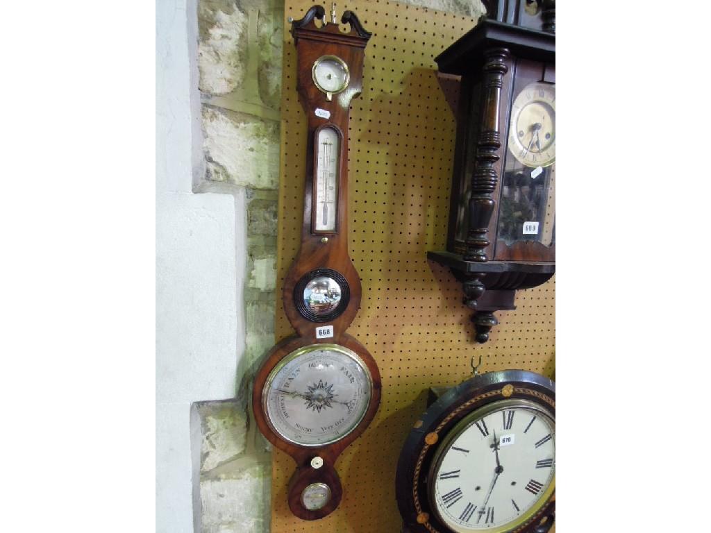 Appraisal: A th century mahogany cased banjo shaped barometer thermometer by