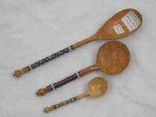 Appraisal: Three Russian carved and turned birch wood spoons the silver