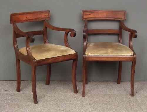 Appraisal: A pair of George III mahogany armchairs with reeded rectangular