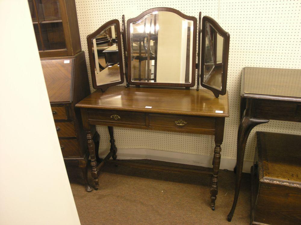 Appraisal: An Edwardian style beech dressing table with folding mirrors attached