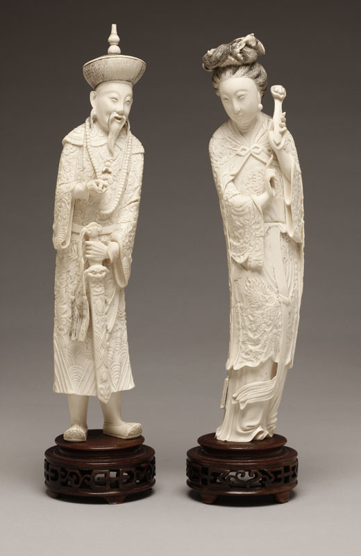 Appraisal: A pair of Chinese carved ivory figures man and woman