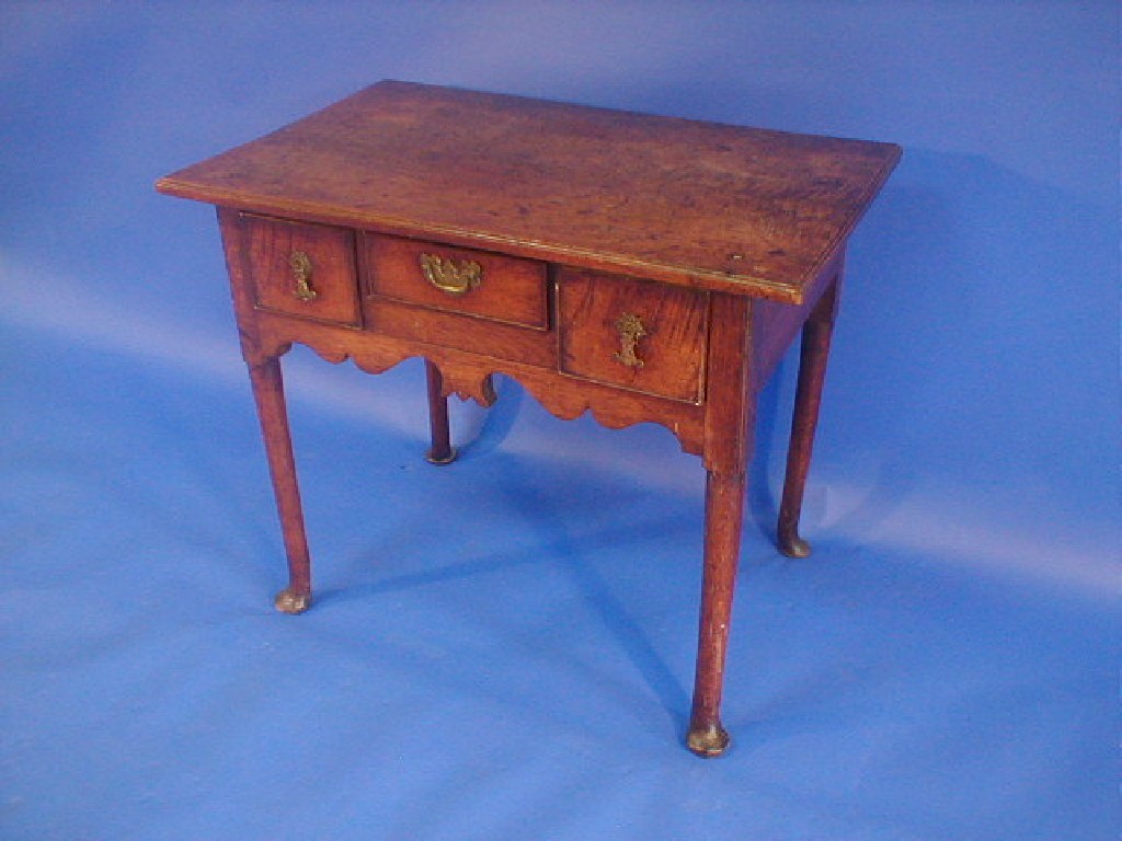 Appraisal: An th century oak low boy with thumb moulded border