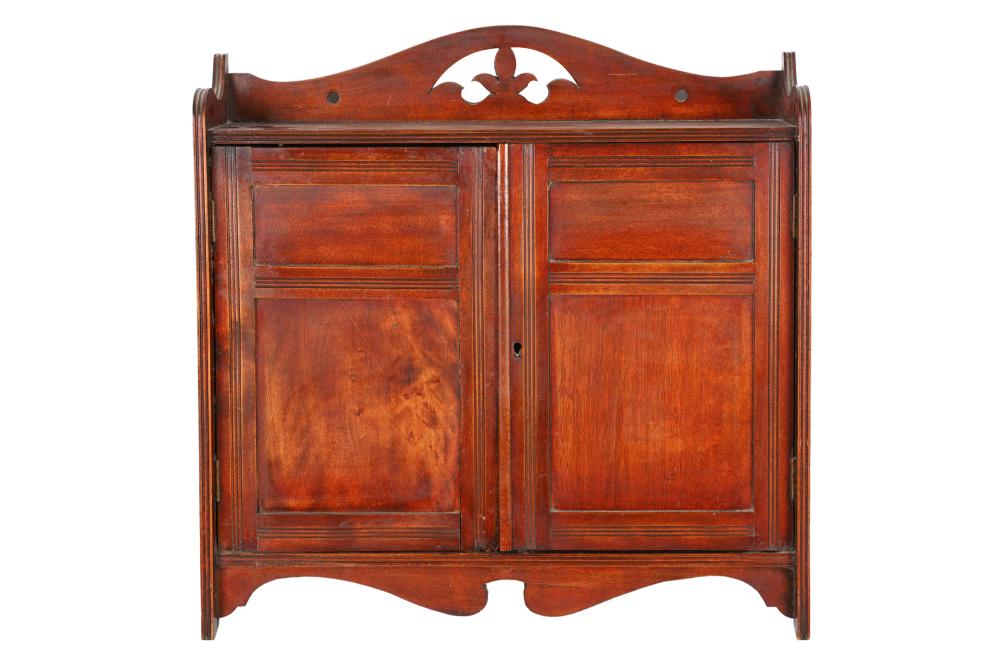 Appraisal: VICTORIAN MAHOGANY HANGING CABINETthe pierced crest over two hinged doors