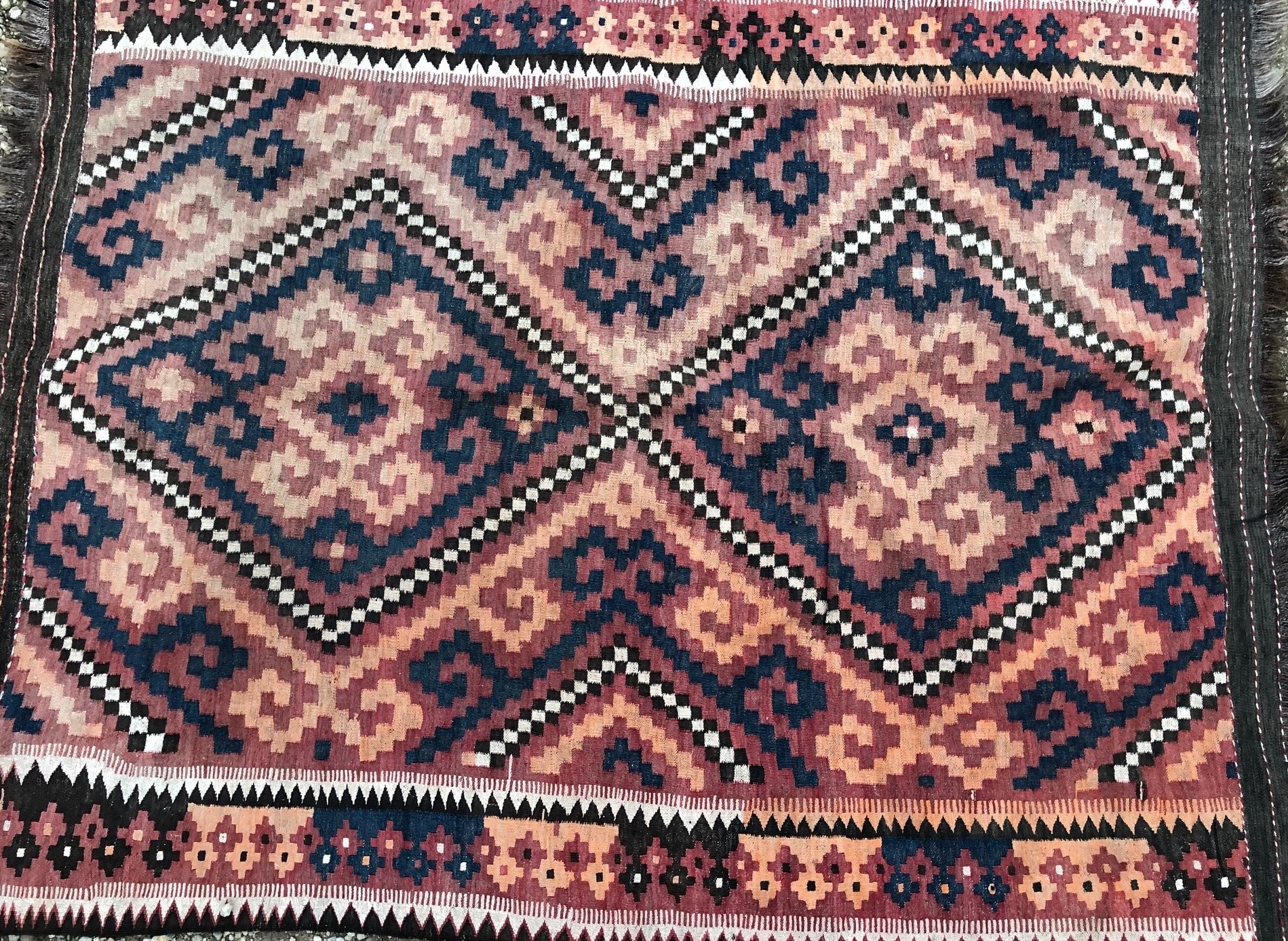 Appraisal: A th century Kelim rug with rust-brown cream and blue