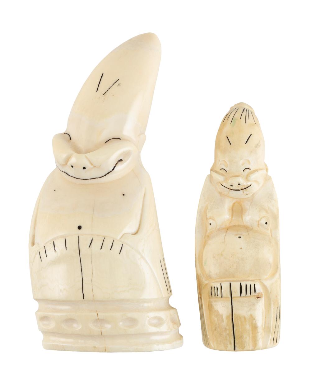 Appraisal: TWO WHALE'S TEETH CARVED IN BILLIKEN FORM TH CENTURY LENGTHS