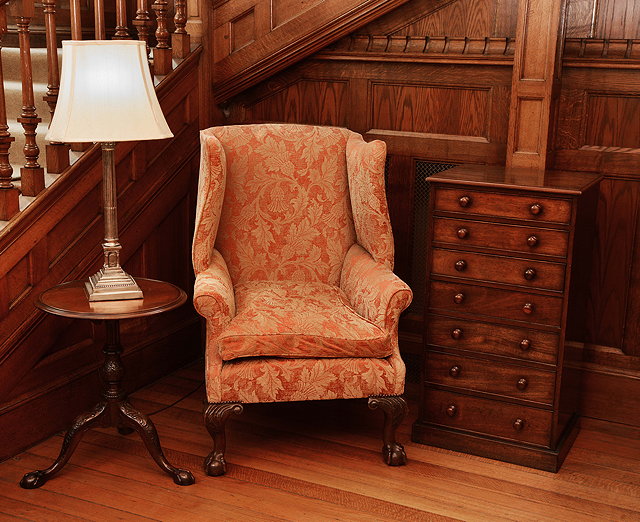 Appraisal: AN ANTIQUE MAHOGANY GEORGIAN STYLE WING BACK ARMCHAIR with squab