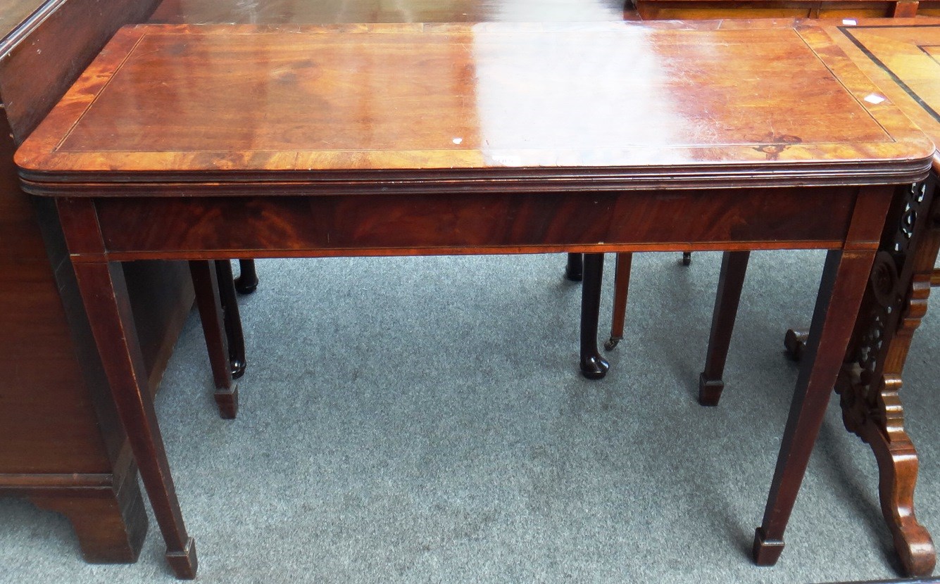 Appraisal: A late George III inlaid mahogany tea table the rounded