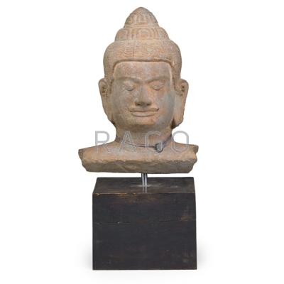 Appraisal: KHMER STYLE BUFF SANDSTONE HEAD OF BUDDHA Lotus petal lappets