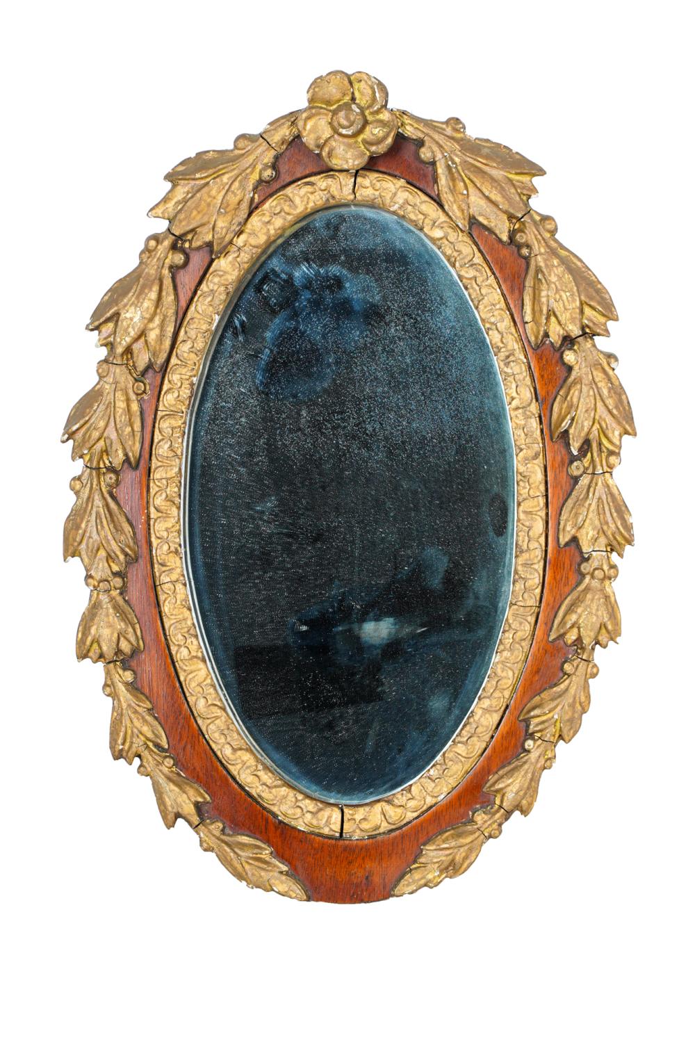 Appraisal: OVAL MAHOGANY CARVED GILT WOOD MIRRORCondition with wear to gilding