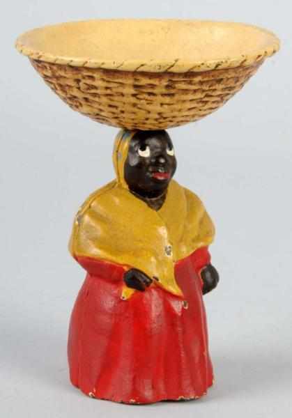 Appraisal: Cast Iron Mammy with Basket on Head Tray Description Made