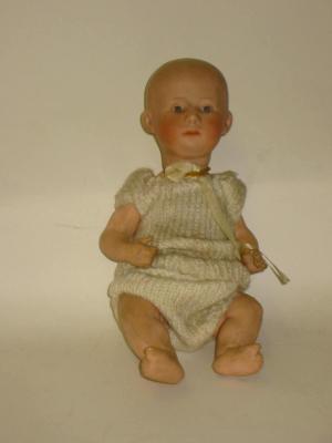 Appraisal: A Heubach bisque head Solemn boy doll with painted face