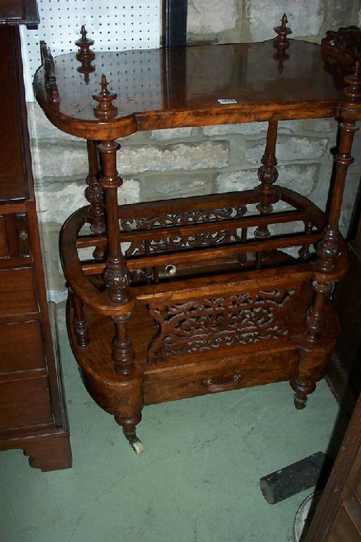 Appraisal: A Victorian figured walnut Canterbury whatnot with shaped outline raised