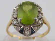 Appraisal: A yellow metal tests carat gold peridot sapphire and diamond