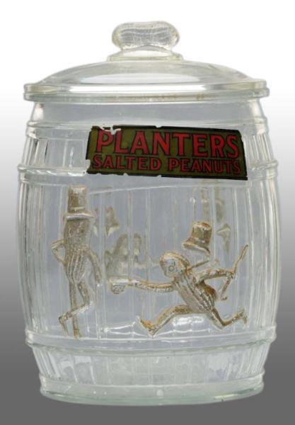 Appraisal: Glass Planters Peanut Barrel Jar Description Includes lid and label