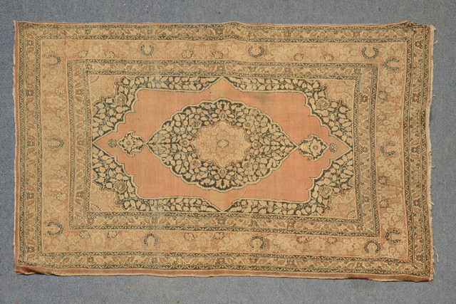 Appraisal: AN OLD PERSIAN TABRIZ ROSE GROUND RUG with a central