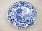 Appraisal: A blue and white side plate with moulded flowering plant