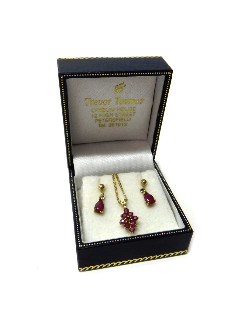 Appraisal: A gold and ruby set nine stone lozenge shaped cluster