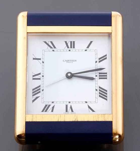 Appraisal: A Cartier brass travel clock with enamel borders with box