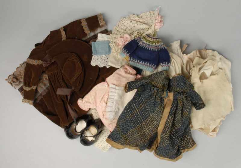 Appraisal: Large Lot of Vintage and Antique Doll Clothes Description Antique