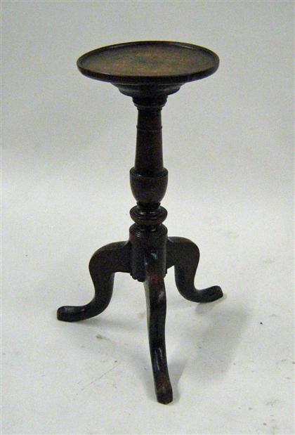 Appraisal: English oak candlestand The dished circular top on a turned