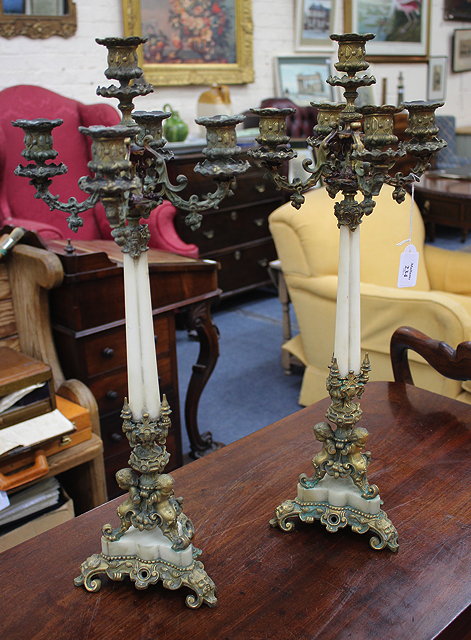 Appraisal: A PAIR OF FRENCH GILT BRONZE AND MARBLE FIVE-LIGHT CANDELABRA