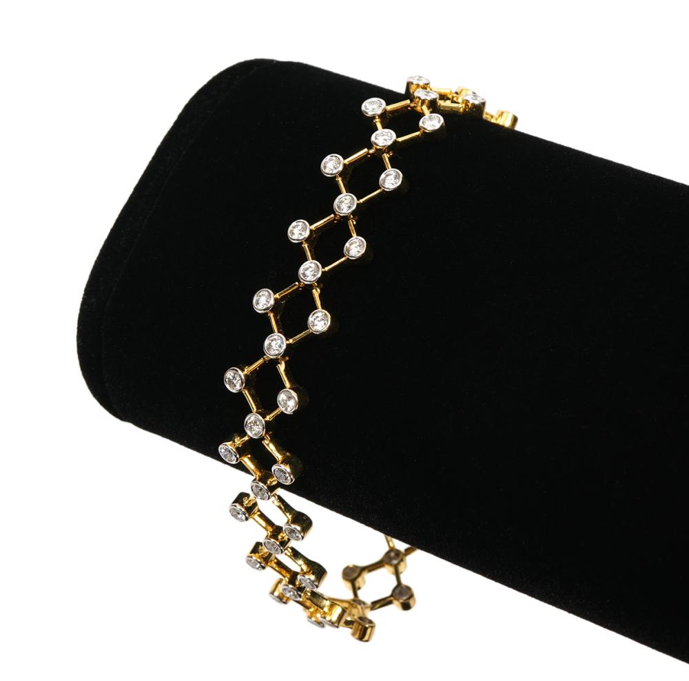 Appraisal: K yellow gold and diamond flexible link bracelet features an