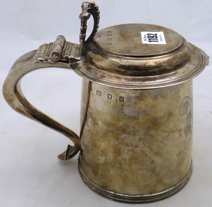 Appraisal: A silver hinge lidded tankard of th century design engraved