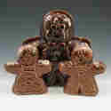 Appraisal: Gingerbread Man salt and pepper shakers and napkin holder Marked