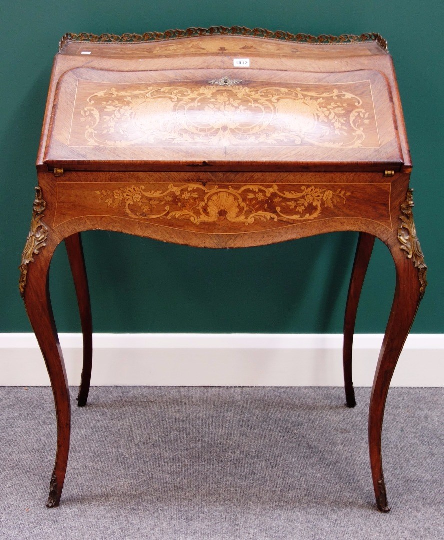 Appraisal: A late th century French gilt metal mounted marquetry inlaid