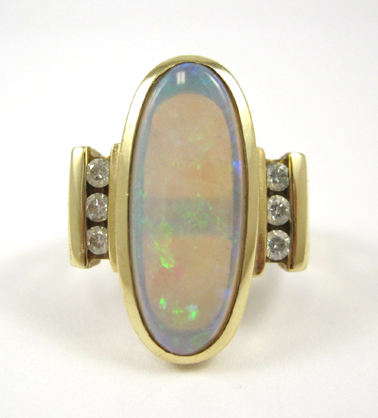 Appraisal: OPAL DIAMOND AND FOURTEEN KARAT GOLD RING Three round-cut diamonds