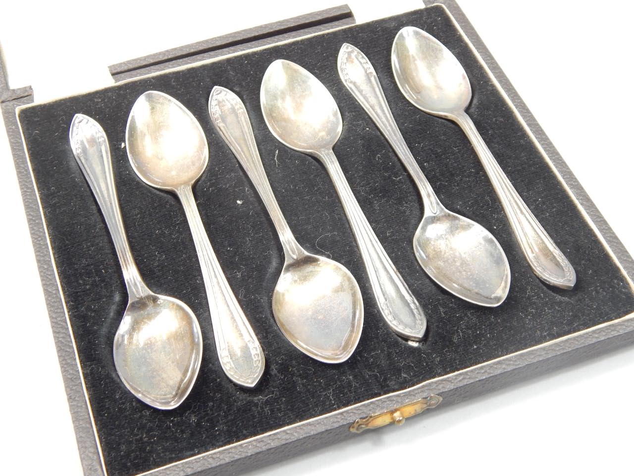 Appraisal: A set of six silver teaspoons each with a bell