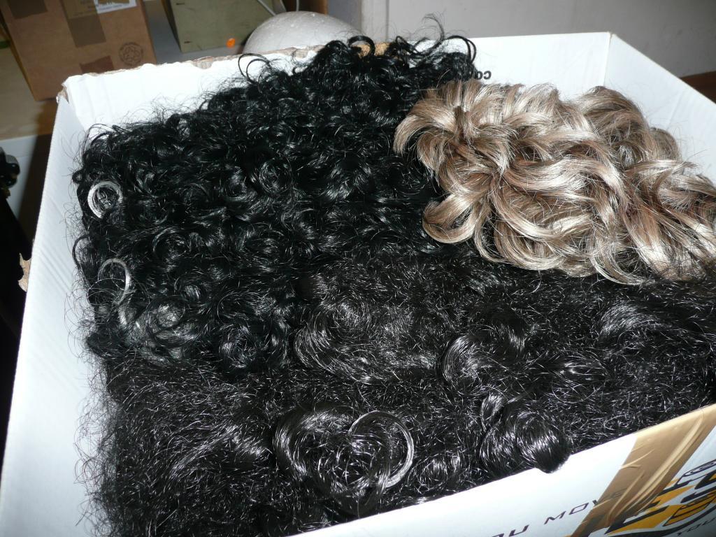 Appraisal: A quantity of theatrical wigs - various styles and eras