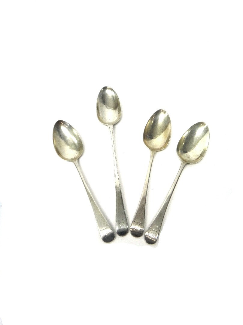 Appraisal: A silver feather edged Old English pattern tablespoon London and