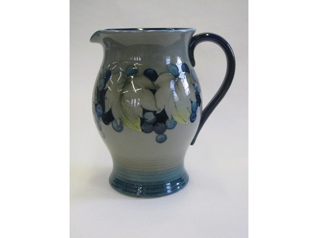 Appraisal: Moorcroft jug with tubelined decoration of fruit and foliage on