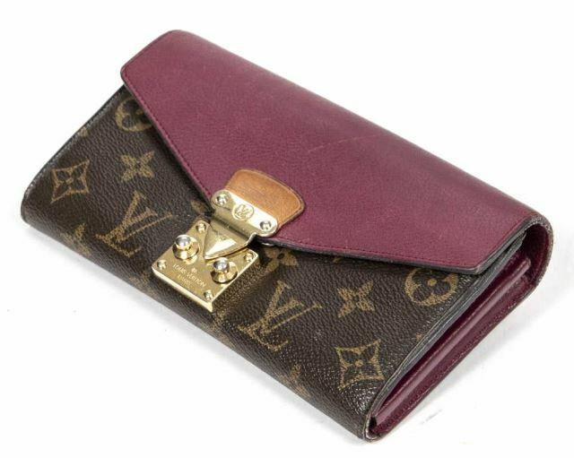 Appraisal: Louis Vuitton Pallas wallet in monogram coated canvas with brass